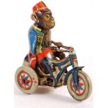 1940'S ARNOLD CLOCKWORK MONKEY ON TRICYCLE