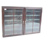 STAINED WOOD AND GLAZED TWIN DOOR DIECAST DISPLAY CABINET