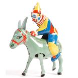 1940'S CLOCKWORK TINPLATE BLOMER AND SCHULER CLOWN JOCKEY