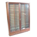 STAINED WOOD AND GLAZED TWIN DOOR DIECAST DISPLAY CABINET