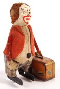 RARE SCHUCO CLOCKWORK CLOWN WITH SUITCASE TOY