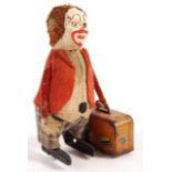 RARE SCHUCO CLOCKWORK CLOWN WITH SUITCASE TOY