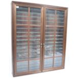 STAINED WOOD AND GLAZED TWIN DOOR DIECAST DISPLAY CABINET