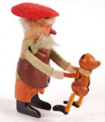 1930'S GERMAN SCHUCO WIND UP DANCING DWARF WITH CHILD TOY