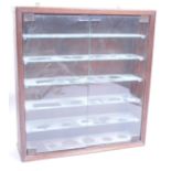 STAINED WOOD AND GLAZED TWIN DOOR DIECAST DISPLAY CABINET