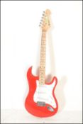 A vintage Rockburn electric six string guitar. The