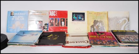 A collection of 7" vinyl 45rpm singles featuring v