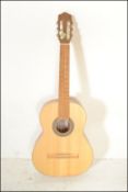 Hokada- An acoustic six string guitar having solid