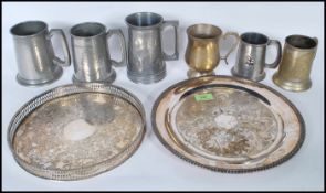 A collection of tankards to include a selection of