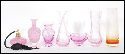 A collection of retro pink studio glass to include