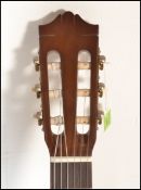 A Yamaha C40 six string acoustic guitar having a s