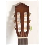 A Yamaha C40 six string acoustic guitar having a s