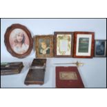 A collection of items to include picture frames, o