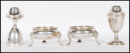 Two pairs of silver hallmarked pepperette and tabl