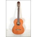 A Yamaha C40 six string acoustic guitar having a s