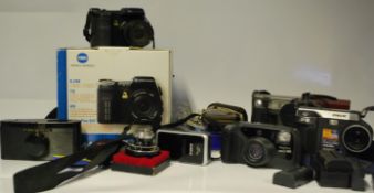 A collection of vintage 35mm cameras, lenses  and