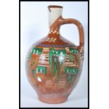 A 20th Century studio pottery ewer jug of bulbous