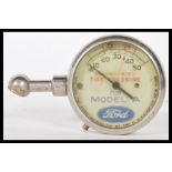 A early 20th Century pre war tyre pressure gauge f