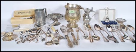 A collection of silver plate and pewter cutlery an