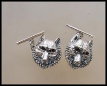 A pair of silver wolf mask gents cufflinks. Each w