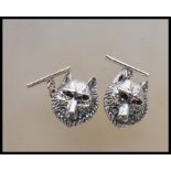 A pair of silver wolf mask gents cufflinks. Each w