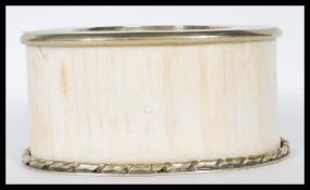 An early 20th Century ivory wine coaster / stand h