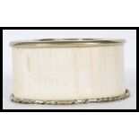 An early 20th Century ivory wine coaster / stand h