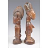 A MALE AND FEMALE PAIR OF WOODEN YORUBA IBEJI