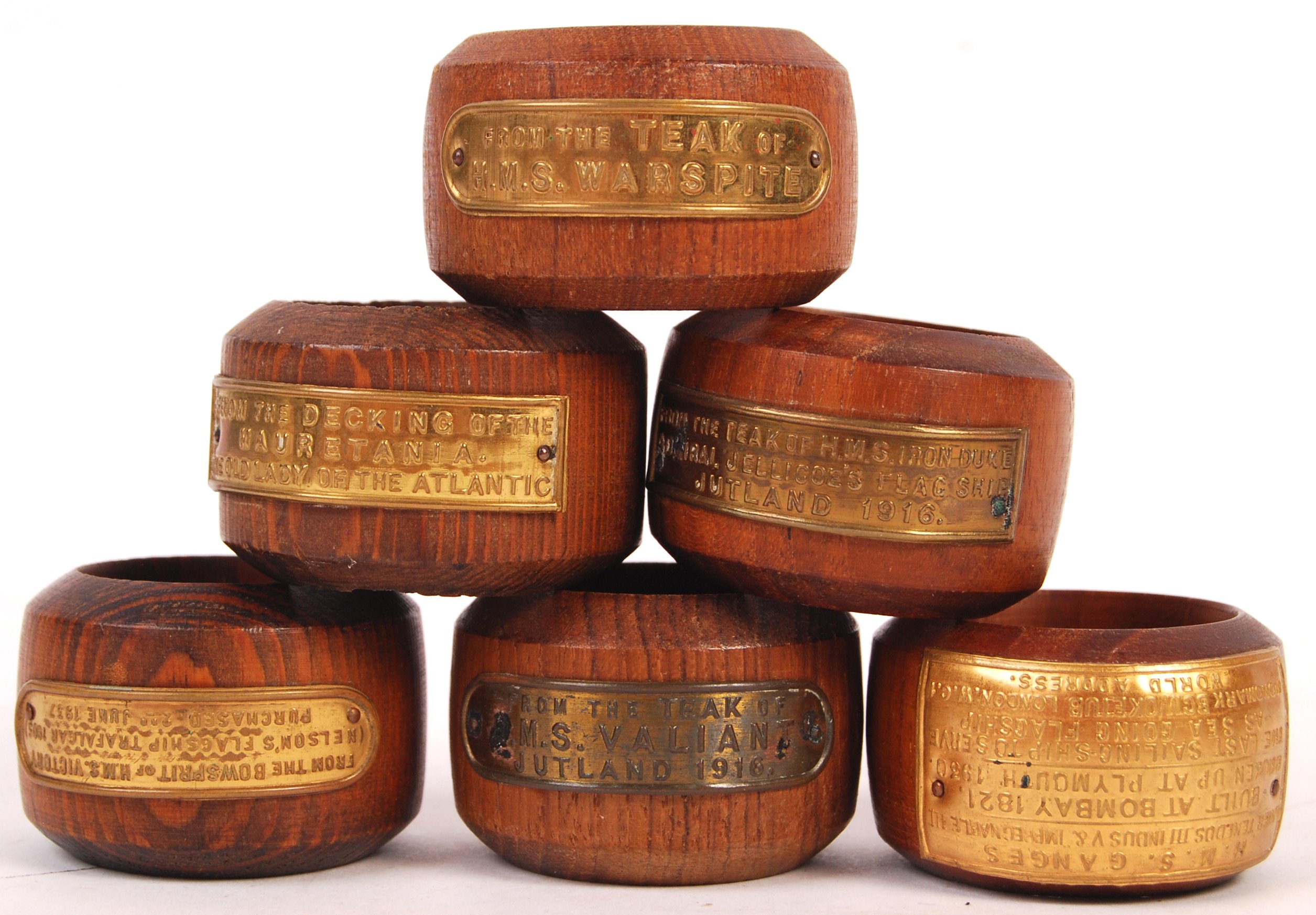 COLLECTION OF ASSORTED NAPKIN RINGS MADE FROM FAMOUS SHIPS