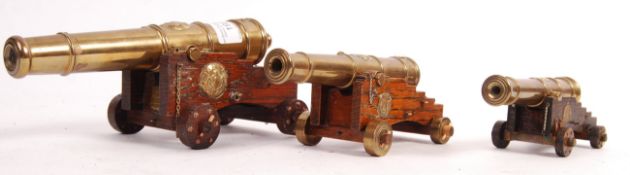 GROUP OF THREE BRASS DESK TOP CANNONS