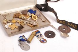 ASSORTED MILITARIA BADGES, MEDALS AND TRENCH ART