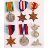 WW2 SECOND WORLD WAR MEDAL GROUP WITH CAP BADGES.