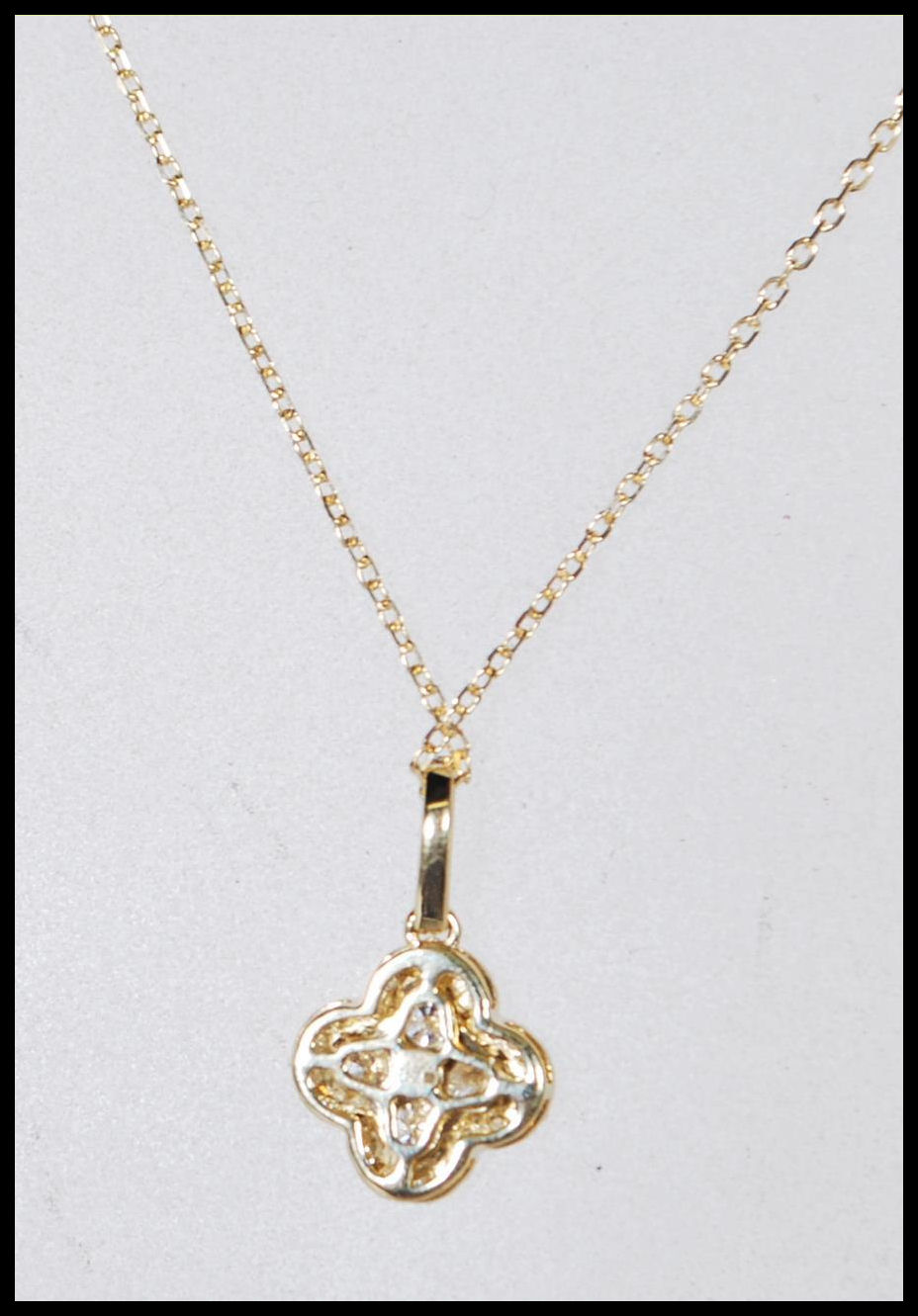A hallmarked 18ct yellow gold necklace having a pendant in the form of a four leaf clover set with - Image 5 of 6