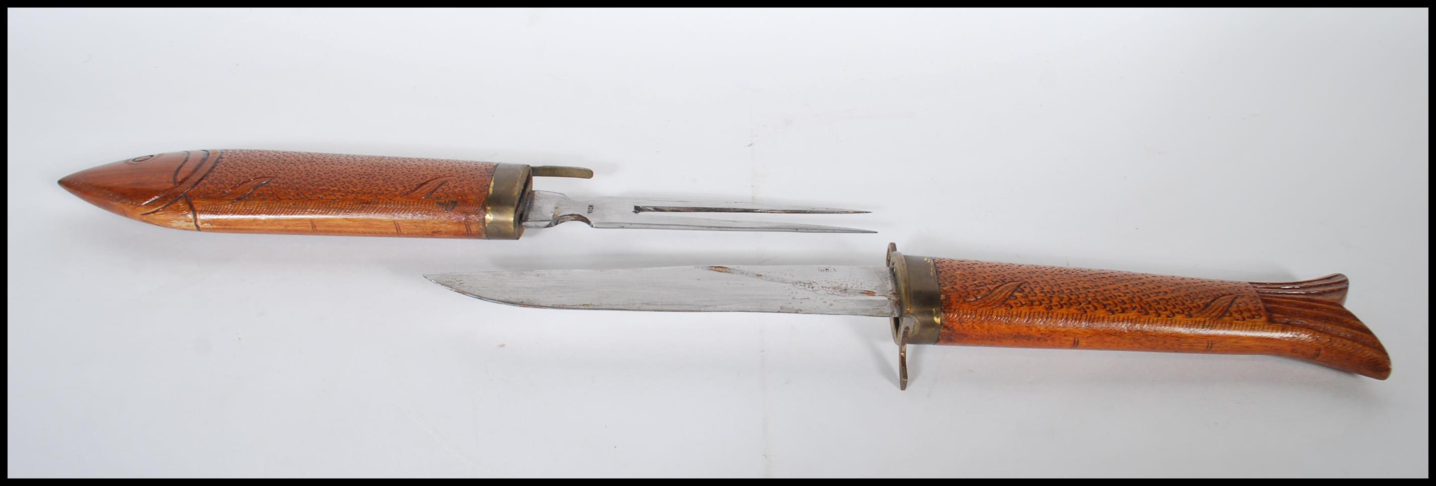 A 20th Century knife and fork carving set, the set carved from hard wood and modelled as a Carp - Image 3 of 4