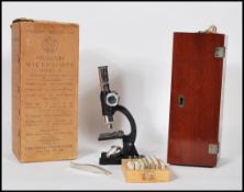 An early 20th Century Student's Microscope Model 3 magnification 100 x. The microscope made in