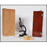 An early 20th Century Student's Microscope Model 3 magnification 100 x. The microscope made in