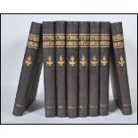 A group of leather bound books with gilt detailing of Newnes Pictorial Knowledge. Eight volumes in