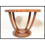 A early 20th Century Art Deco oak top hall table of circular form having applied walnut panels to