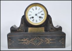 A late 19th Century high Victorian marble mantel clock having white enamel dial with Roman numeral