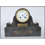 A late 19th Century high Victorian marble mantel clock having white enamel dial with Roman numeral