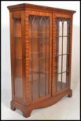 A 20th Century mahogany twin door display / china cabinet, twin full length astral glazed doors
