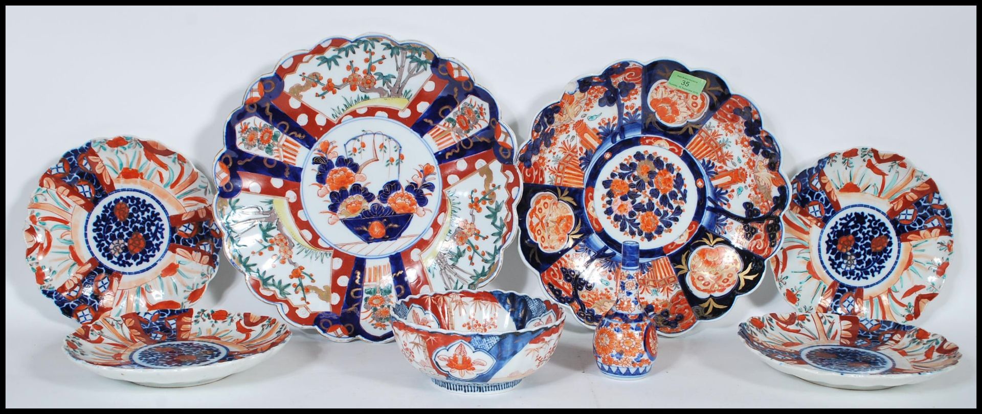 A collection of 20th Century Japanese Imari ceramics to include two wall charger plates having