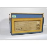 A vintage retro 20th Century two tone Dansette Bermuda four speed portable record player in blue and