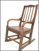 A 19th Century Georgian beech and elm rocking chair, shaped reeded splayed backrest with shaped