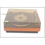 A vintage Bang and Olufsen Beogram 1000 teak and ebony record deck turntable having original perspex