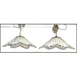 A matching pair of vintage 20th Century Tiffany style leaded glass hanging ceiling light shades in