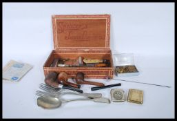 A dealers lot to include smoking pipes, vintage li