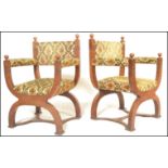 A pair of early 20th Century oak cross framed Glastonbury throne chairs having U formed supports and