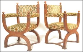 A pair of early 20th Century oak cross framed Glastonbury throne chairs having U formed supports and