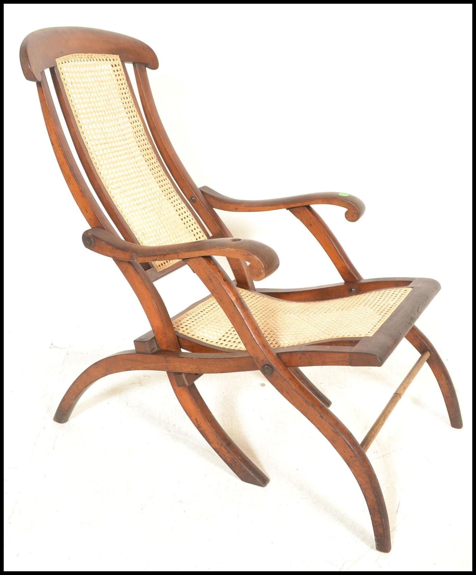 An early 20th Century campaign folding steamer chair of beech construction having caned backrest and - Image 4 of 5